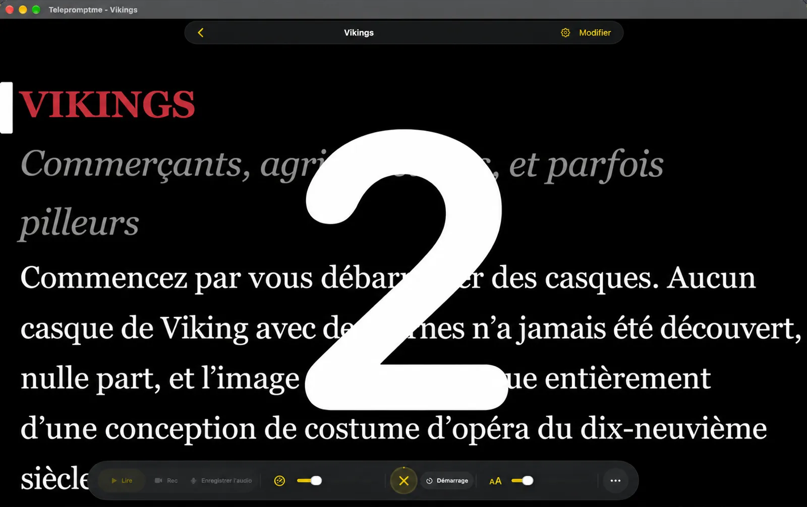 Un grand nombre de compte à rebours remplissant l'écran du téléobjectif, avec le dock affichant un bouton d'annulation et le statut Démarrage