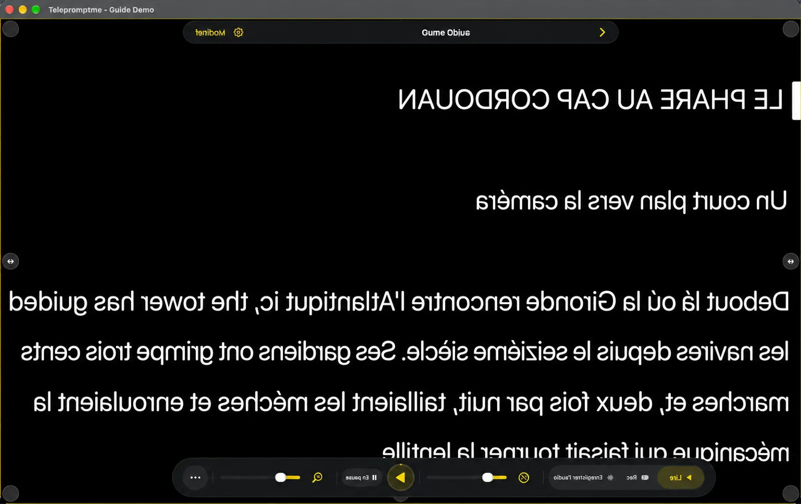 Le téléobjectif avec le texte reflété de gauche à droite, et le dock et la barre de navigation reflétés avec lui
