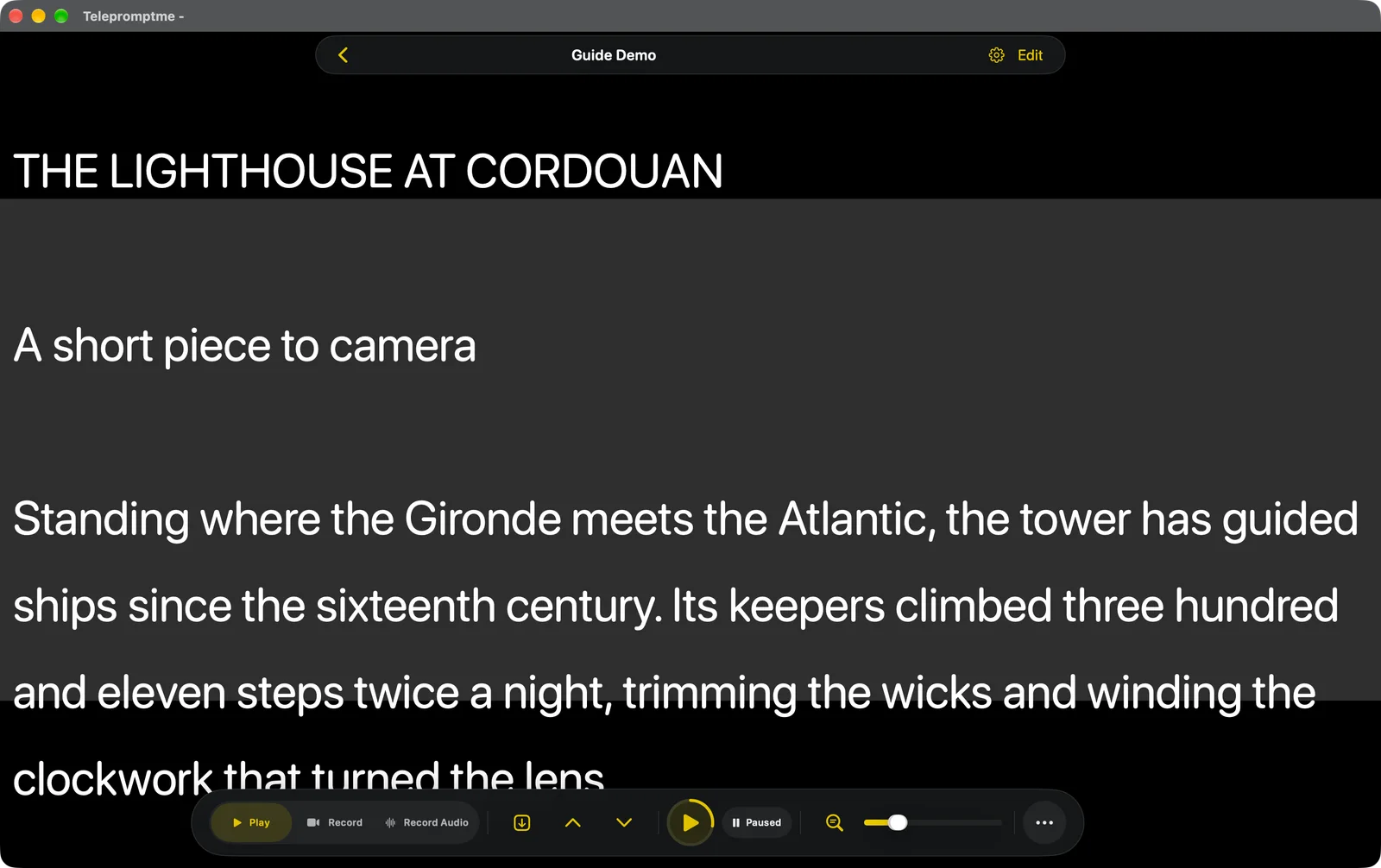 The teleprompter in Manual Page mode, with a grey band across the middle of the view and two chevrons in the dock
